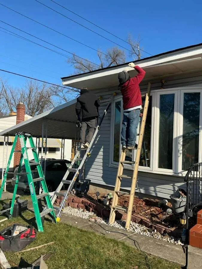 Restoration crew performing exterior repair in Busti